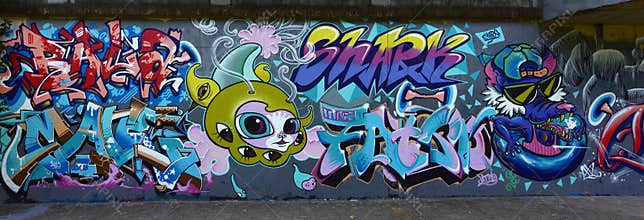 The city graffiti on the cement wall