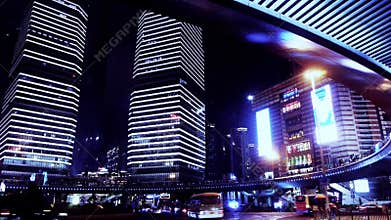 Time lapse light trails of cars under overpass & skyscraper,shanghai,china.