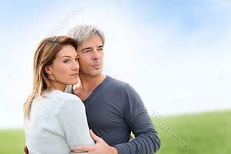 Middle-aged couple looking towards future