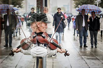 Street artist playing violin