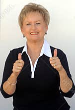 Older business woman thumbs up