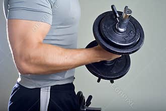 Healthy man hard workout in gym