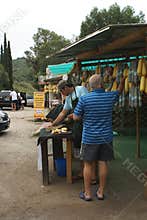 Tourist buying cheese and salami