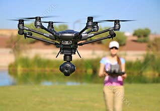 Woman Flying High-Tech Camera Drone (Large File)