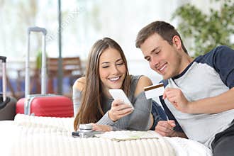Couple of tourists booking hotel online