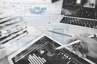 Website designer working digital tablet and computer laptop with