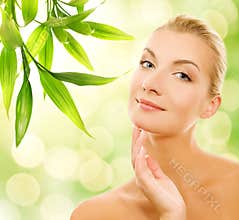 Woman applying organic cosmetics