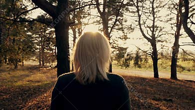 Girl Walking in the Forest