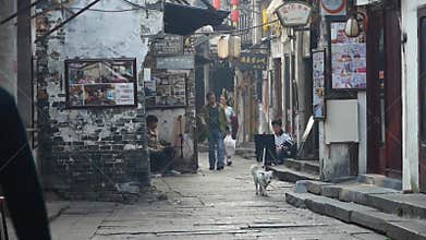 Traditional Chinese old town houses & street,some students drawing.