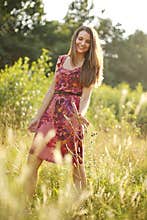 Pretty teenage girl in the summer park