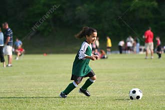 Young Girl Playing Soccer