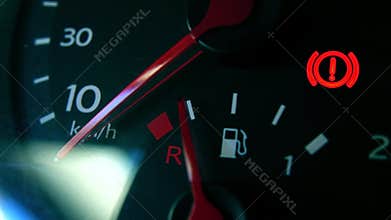 Car fuel gauge and attention sign 4K macro shot