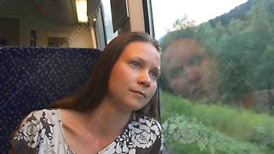 Dreaming woman traveling by train