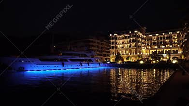 Night town Tivat in Porto Montenegro. Hotel and Sailing boats in the Boka bay, Montenegro, Adriatic, September 2016 in