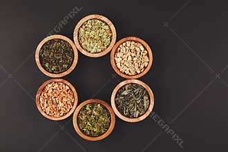 Assortment of dry tea in little bowls