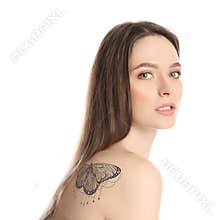 Woman with beautiful tattoo of butterfly on her body against white background