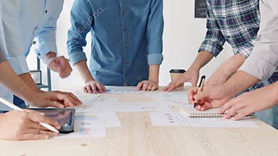 Young Asian business financial team work together in project brainstorm meeting. Cooperate teamwork, strategy planning concept