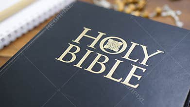 Holy Bible on Brown Wooden Table