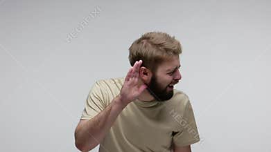 What? I can`t hear you! Deaf bearded man asking to repeat, having hearing problems, misunderstanding in communication, difficult t