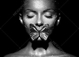 Fashion model woman with blue butterfly
