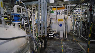 Chemical plant inside. Equipment, steel tanks and boilers for chemical mixing