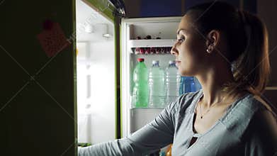 Greedy woman having a delicious late night snack