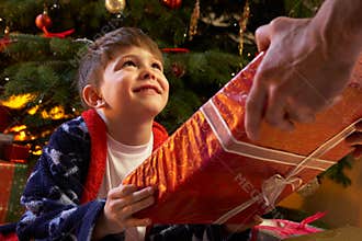 Young Boy Receiving Christmas Present