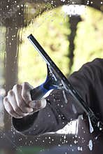 Clean window with squeegee