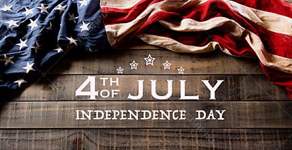 Happy Independence Day. American flags against old wooden background. July 4