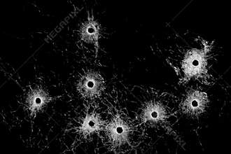 Broken glass - bullet holes isolated on black
