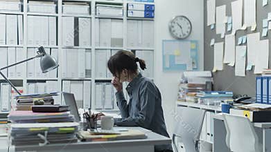 Efficient businesswoman working in her office