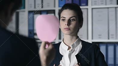 Business woman adjusting her look