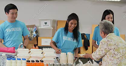 Male and female volunteer preparing free food delivery for poor people during covid19.