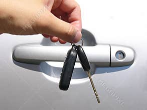 Hands and car key
