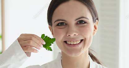 Pretty young woman recommending vegan natural cosmetics.