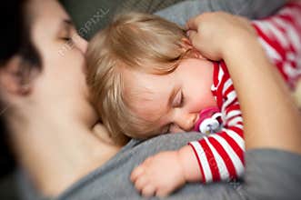 Mother hold sleeping baby