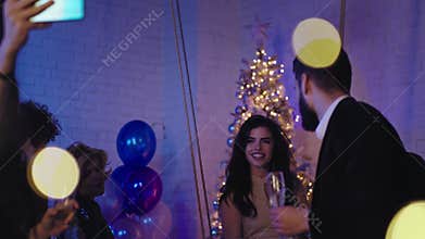Christmas stuff party group of young workers celebrating together they dancing taking selfies and enjoying the moment