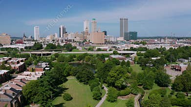 Elevating up over the outskirts of Tulsa Oklahoma near the Arkansas River