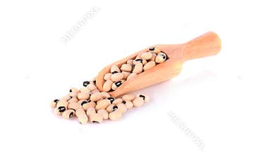 Blackeye Peas in Wood Scoop Isolated on White Background