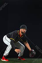 Baseball player on dark background. Ballplayer portrait.