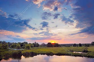Beautiful sunrise and dramatic clouds on the sky.