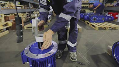 Gearbox assembly process. Gearboxes assembly at the factory. Gear motors manufacturing