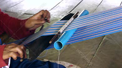 Woman karen tribal weaving of traditional at countryside in Thailand