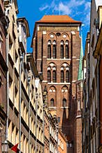 Twin towers of St. Maryâ€™s Basilica - Bazylika Mariacka - seen from Kaletnicza street in the historic old town city center