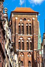 Twin towers of St. Maryâ€™s Basilica - Bazylika Mariacka - seen from Kaletnicza street in the historic old town city center
