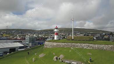 Lighthouse and old coastal fortifications with artillery on Faroe Islands
