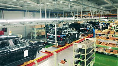 Automobile, car factory conveyor. Car bodies in the factory unit in the process of assembly