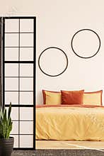 Stylish bedroom with yellow and ginger accents