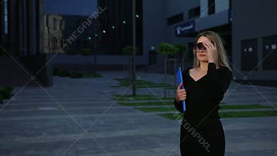 Employee or secretarywalking down street to meet boss, even a businesswoman
