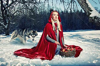 Red hood and a wolf behind her.
